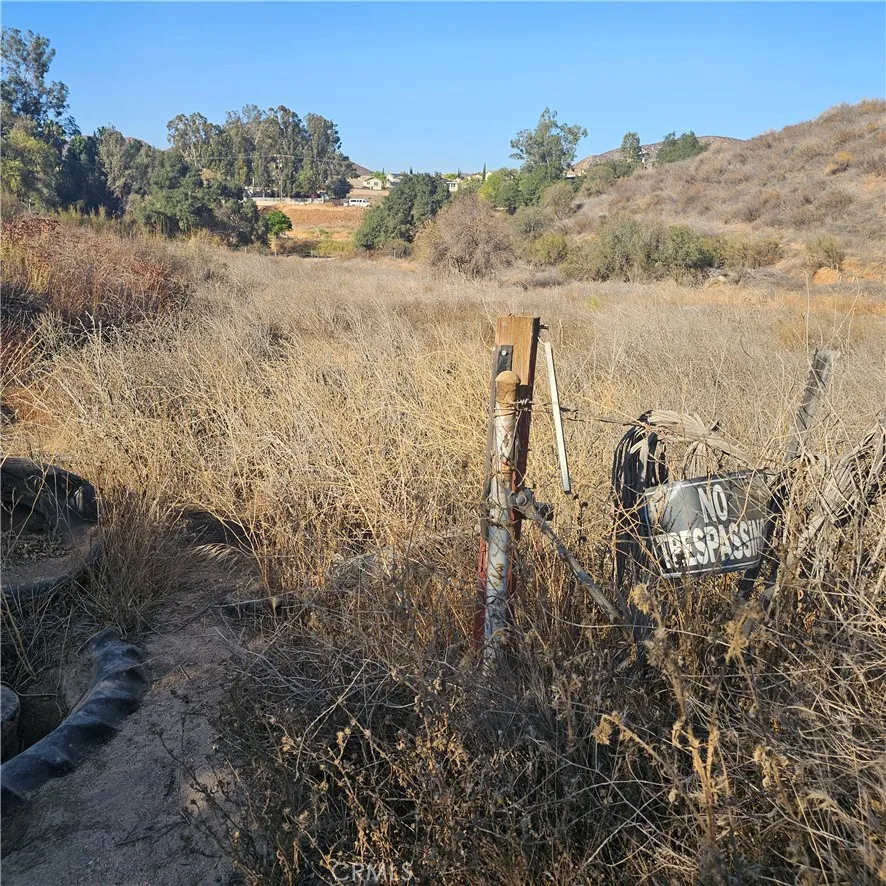 0 Locust Street Menifee, CA 92584 - Photo 8 of 11 a view of a dry yard with lots of trees