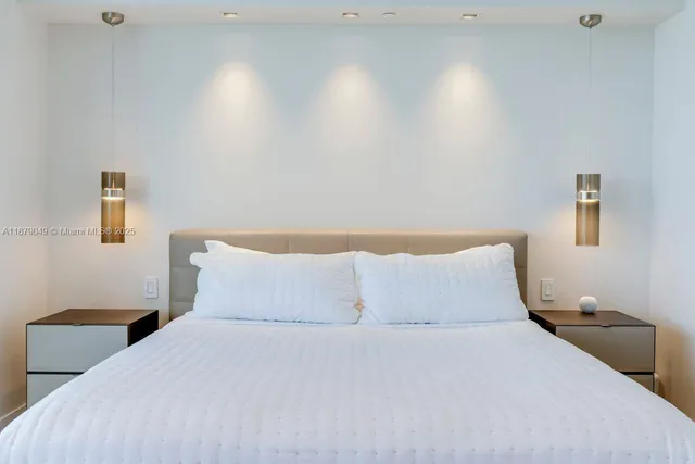 a bathroom with a granite countertop sink toilet and mirror