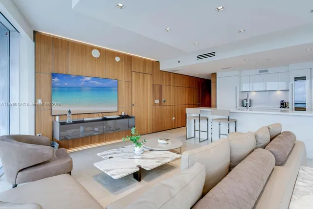 a bedroom with a bed and glass window