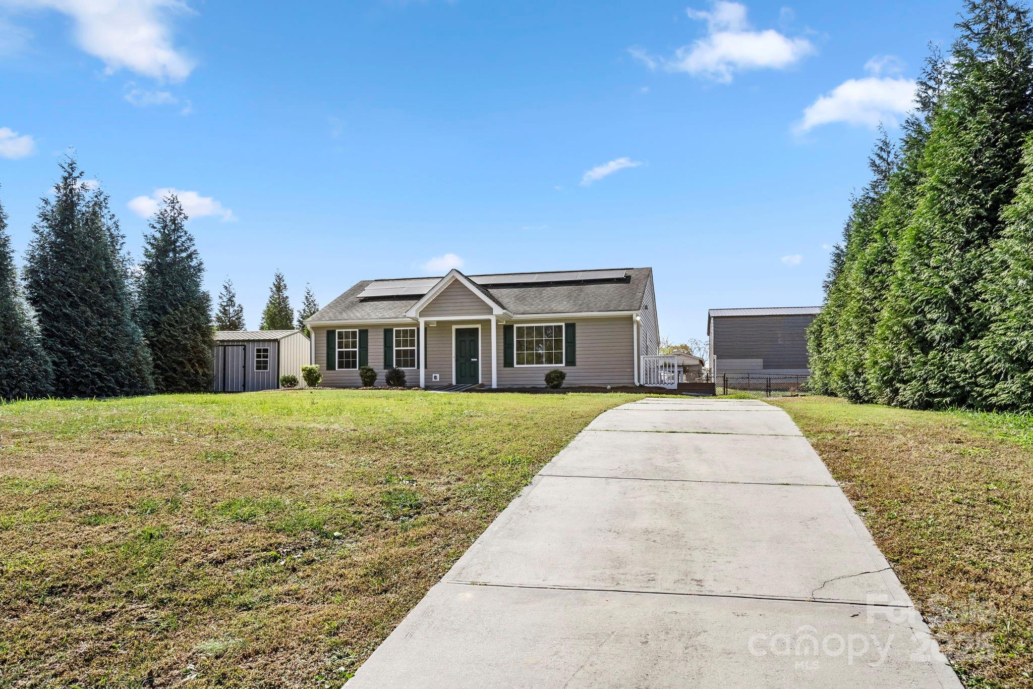 a front view of a house with yard