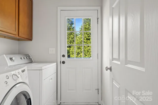 a view of storage and utility room with washer and dryer