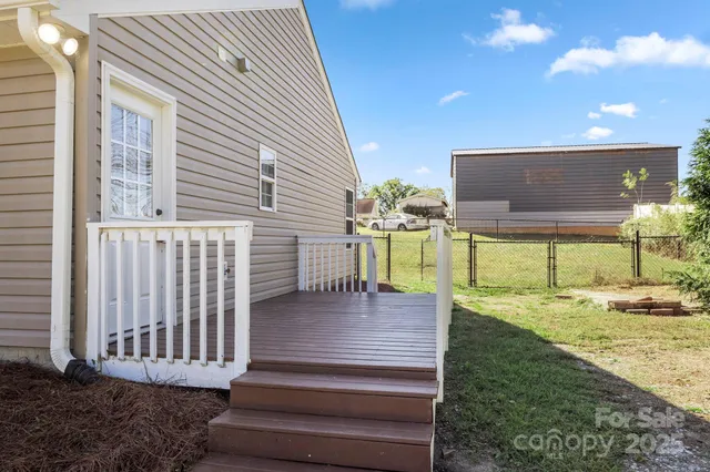 a view of a patio with a table and chairs