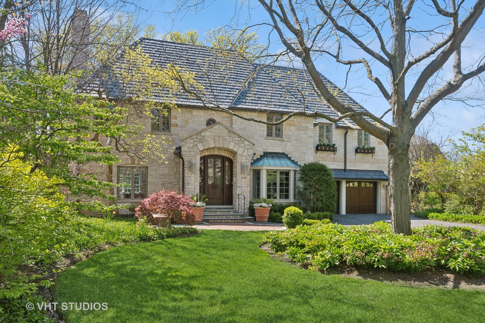 a front view of a house with garden