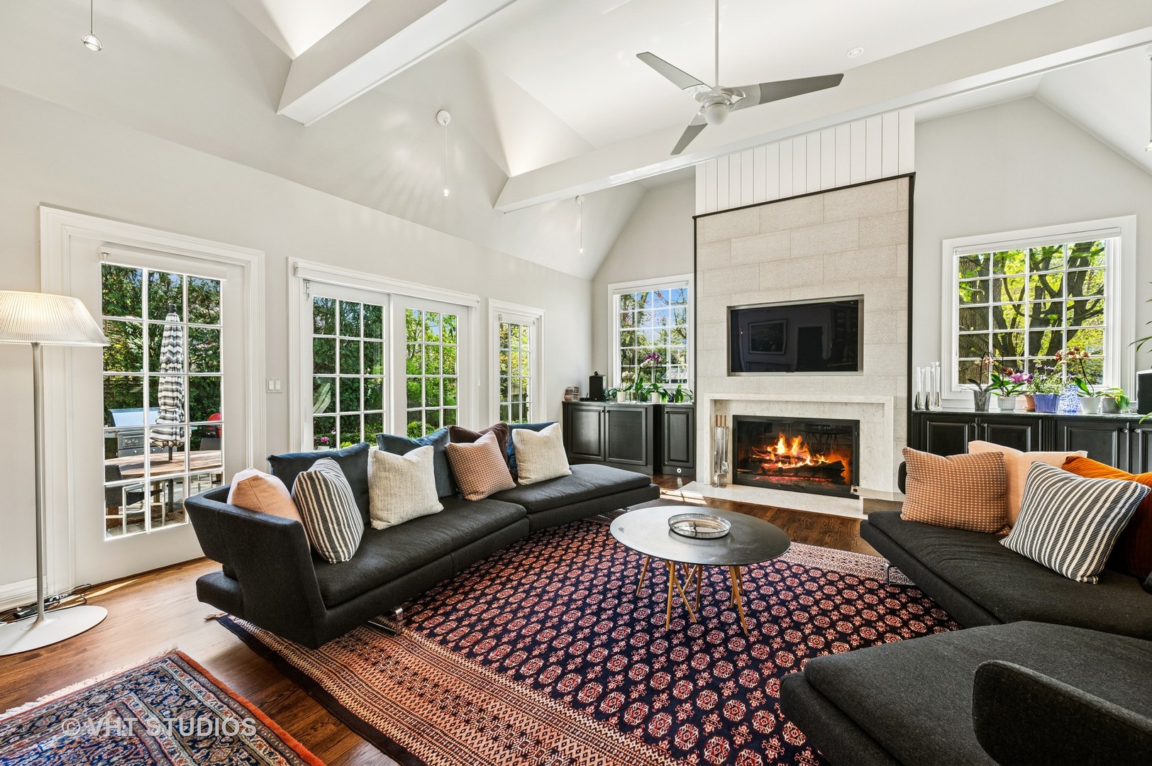474 Sheridan Road Winnetka, IL 60093 - Photo 11 of 36 a living room with furniture a rug and a fireplace