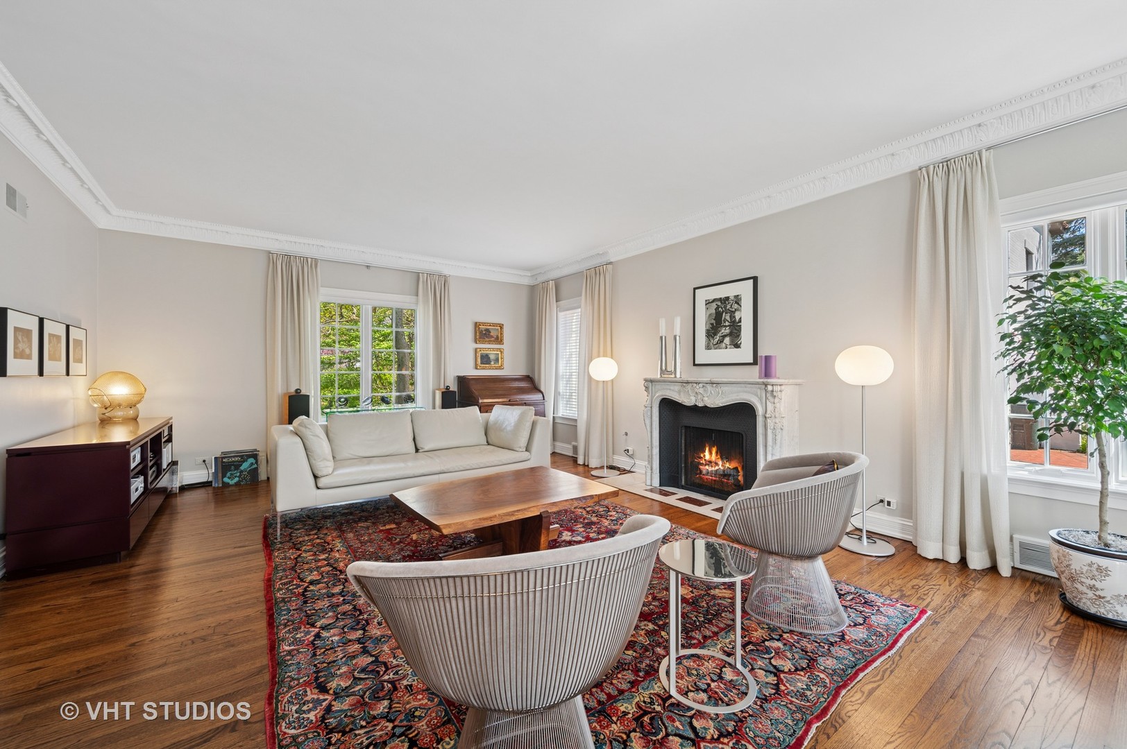 474 Sheridan Road Winnetka, IL 60093 - Photo 4 of 36 a living room with furniture and a fireplace