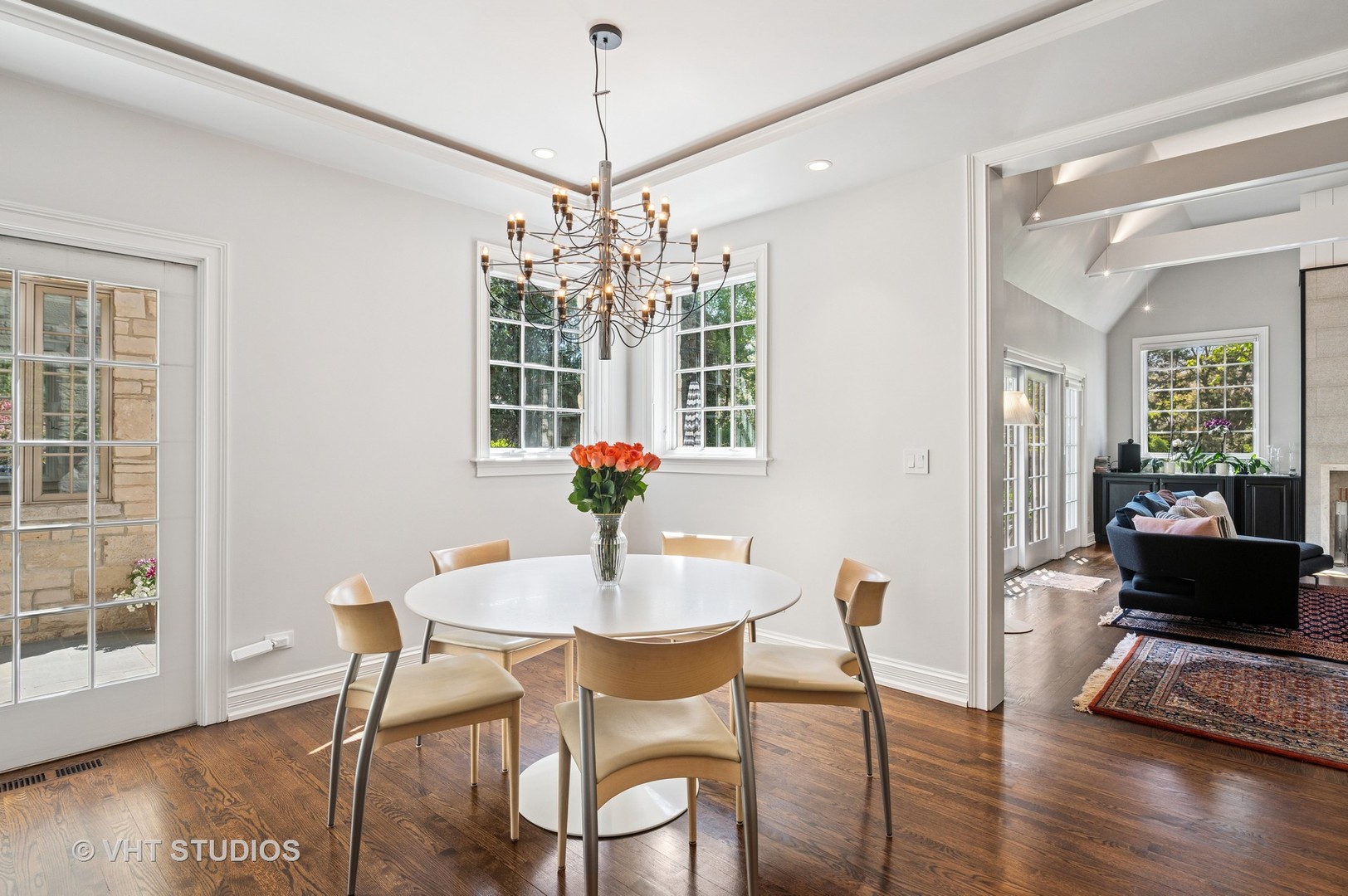 474 Sheridan Road Winnetka, IL 60093 - Photo 9 of 36 a view of a dining room with furniture wooden floor and chandelier
