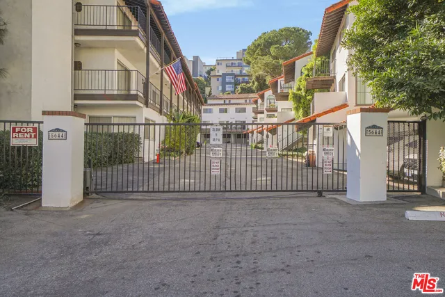 a view of a wrought iron fences in front of house