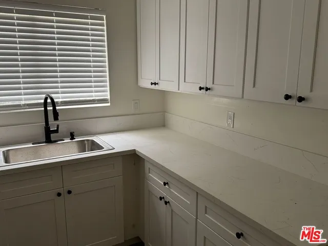 a view of cabinets with sink