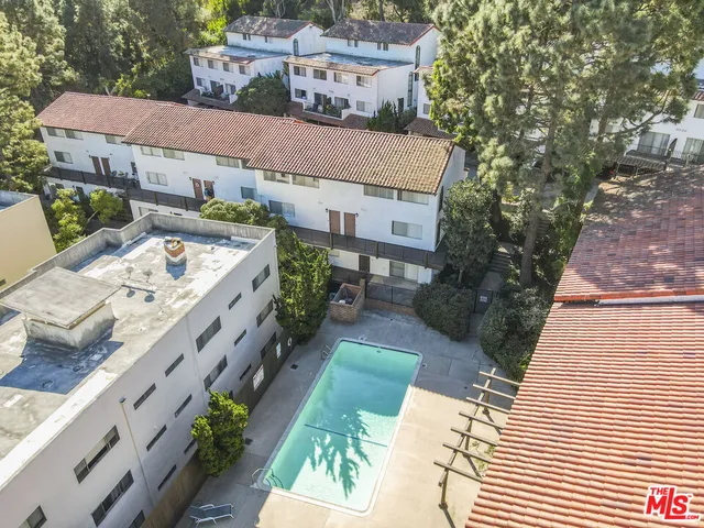 a aerial view of a house with a yard