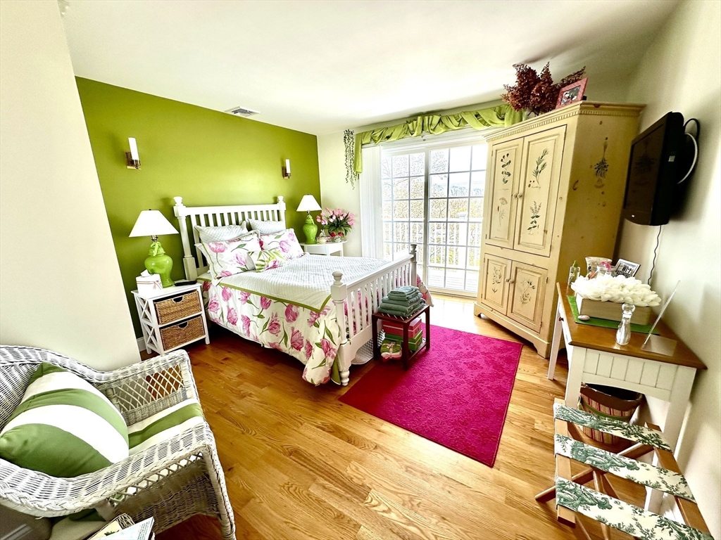 1467 State Road Plymouth, MA 02360 - Photo 13 of 31 a bedroom with a bed chair and dresser