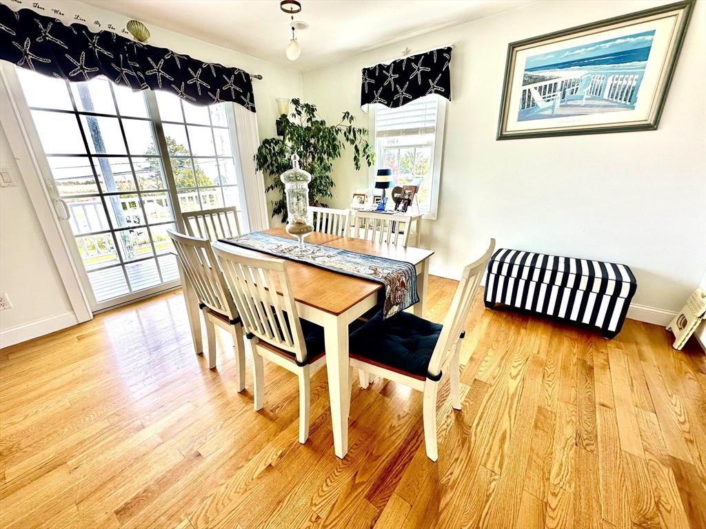 1467 State Road Plymouth, MA 02360 - Photo 7 of 31 a dining room with furniture and wooden floor
