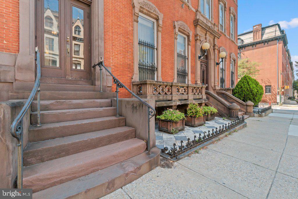 1118 St Paul Street, Unit 1 Baltimore, MD 21202 - Photo 2 of 8 a view of a building with potted plants