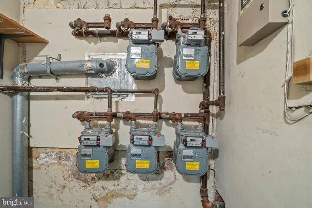 a view of an empty room with stairs and ventilation