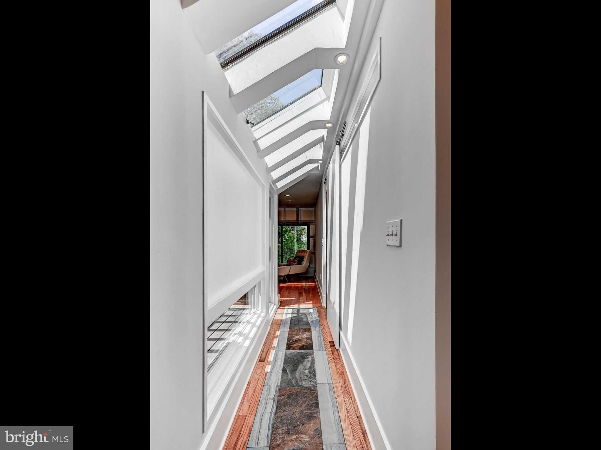 2025 Skyline Road Towson, MD 21204 - Photo 28 of 38 a view of a hallway with wooden floor and staircase