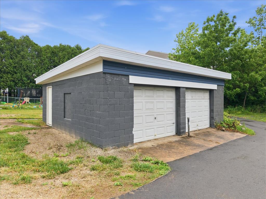 5641 North Coplay Road Whitehall, PA 18052 - Photo 61 of 68 A detached two-car garage crafted from durable concrete block, providing ample storage and vehicle protection.
