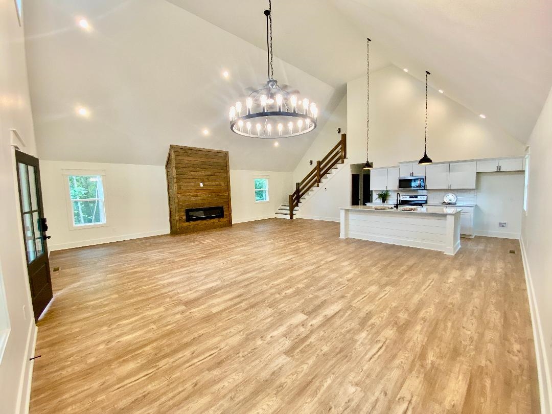 265 Rock Quarry Way Counce, TN 38326 - Photo 2 of 17 a view of a kitchen with a sink and a chandelier