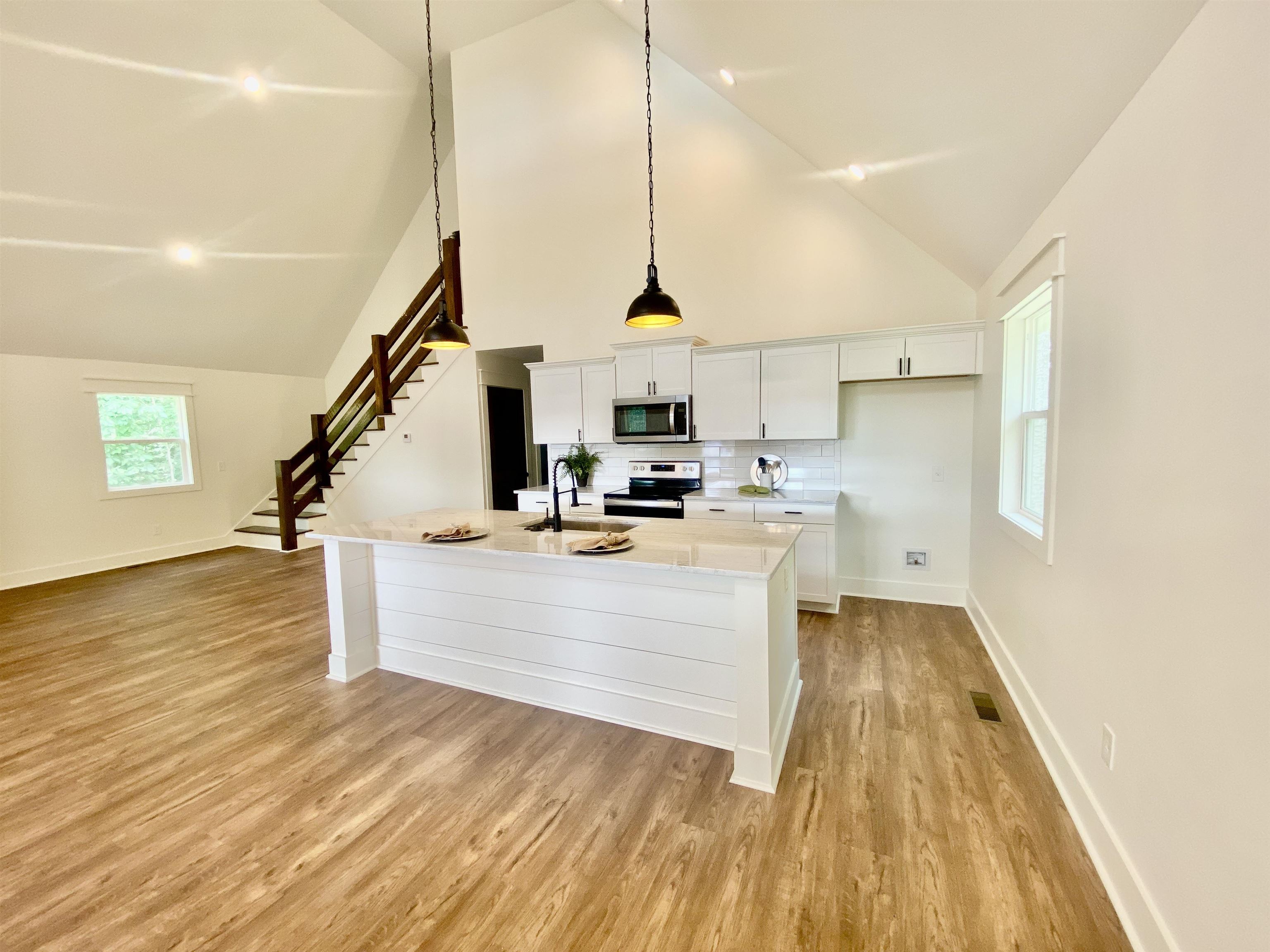 265 Rock Quarry Way Counce, TN 38326 - Photo 3 of 17 a view of kitchen with wooden floor and electronic appliances