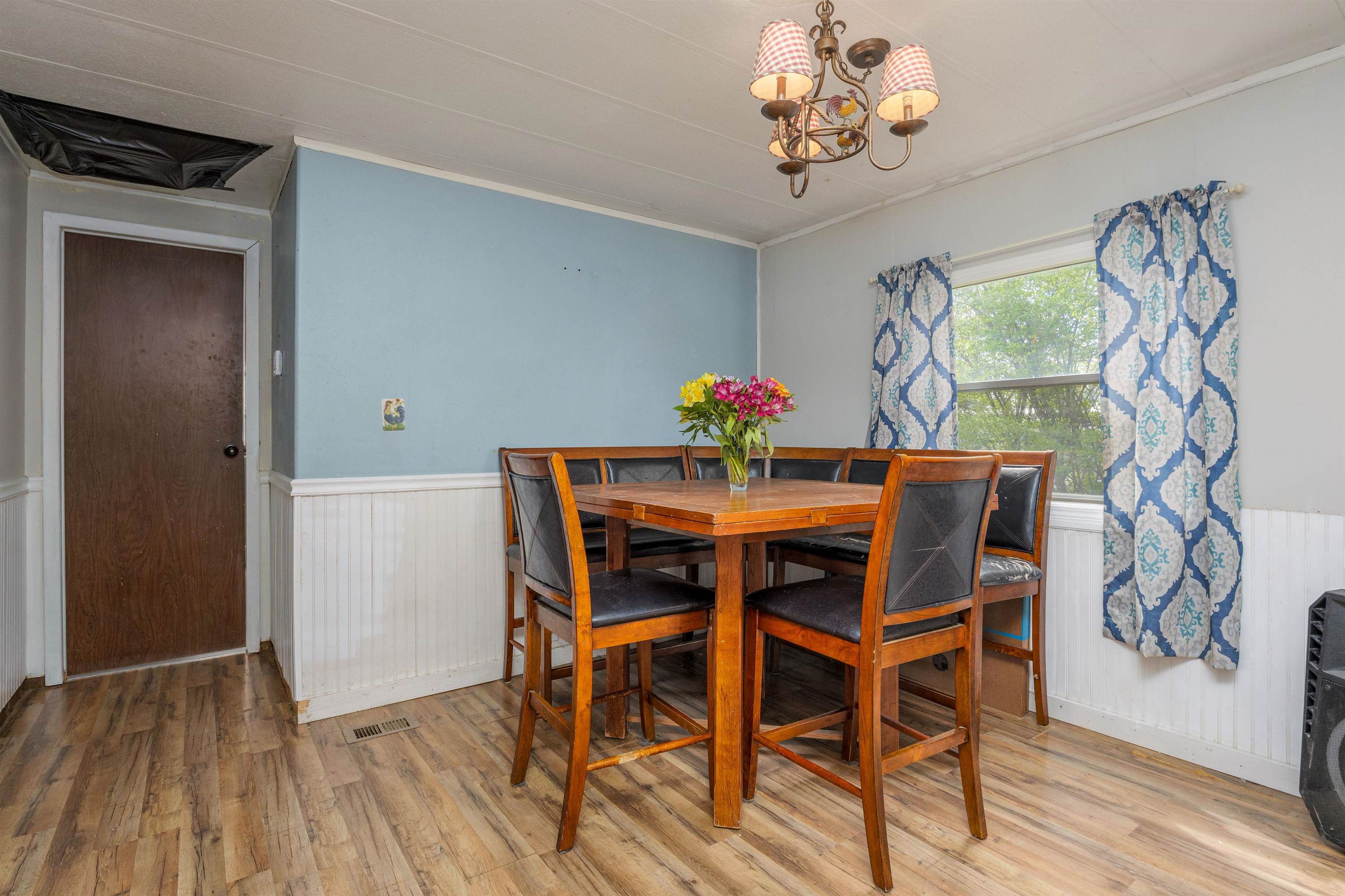 265 Southwest 11th Avenue Cedaredge, CO 81413 - Photo 14 of 39 a dining room with furniture and wooden floor