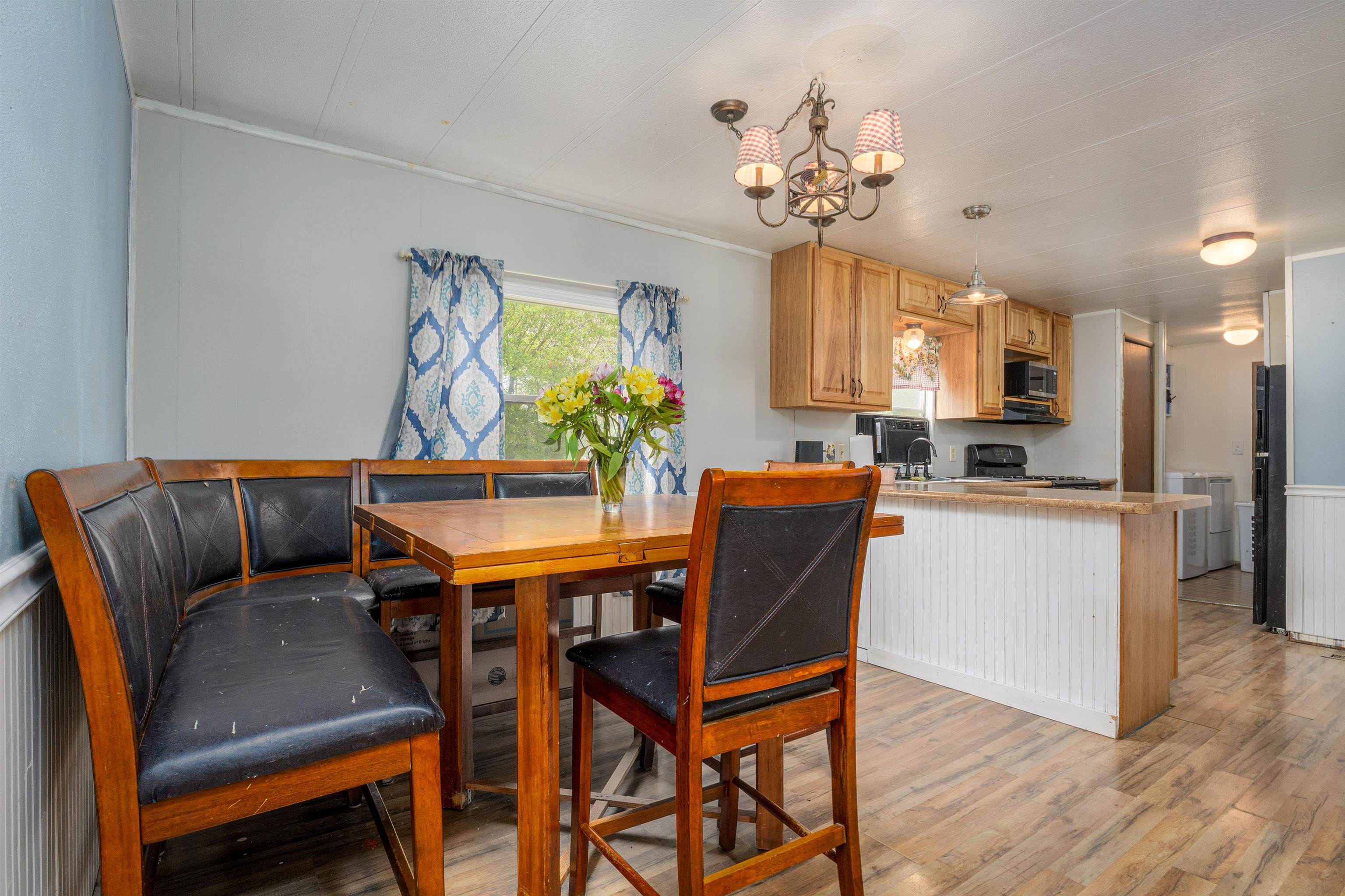 265 Southwest 11th Avenue Cedaredge, CO 81413 - Photo 15 of 39 a view of a dining room with furniture and chandelier
