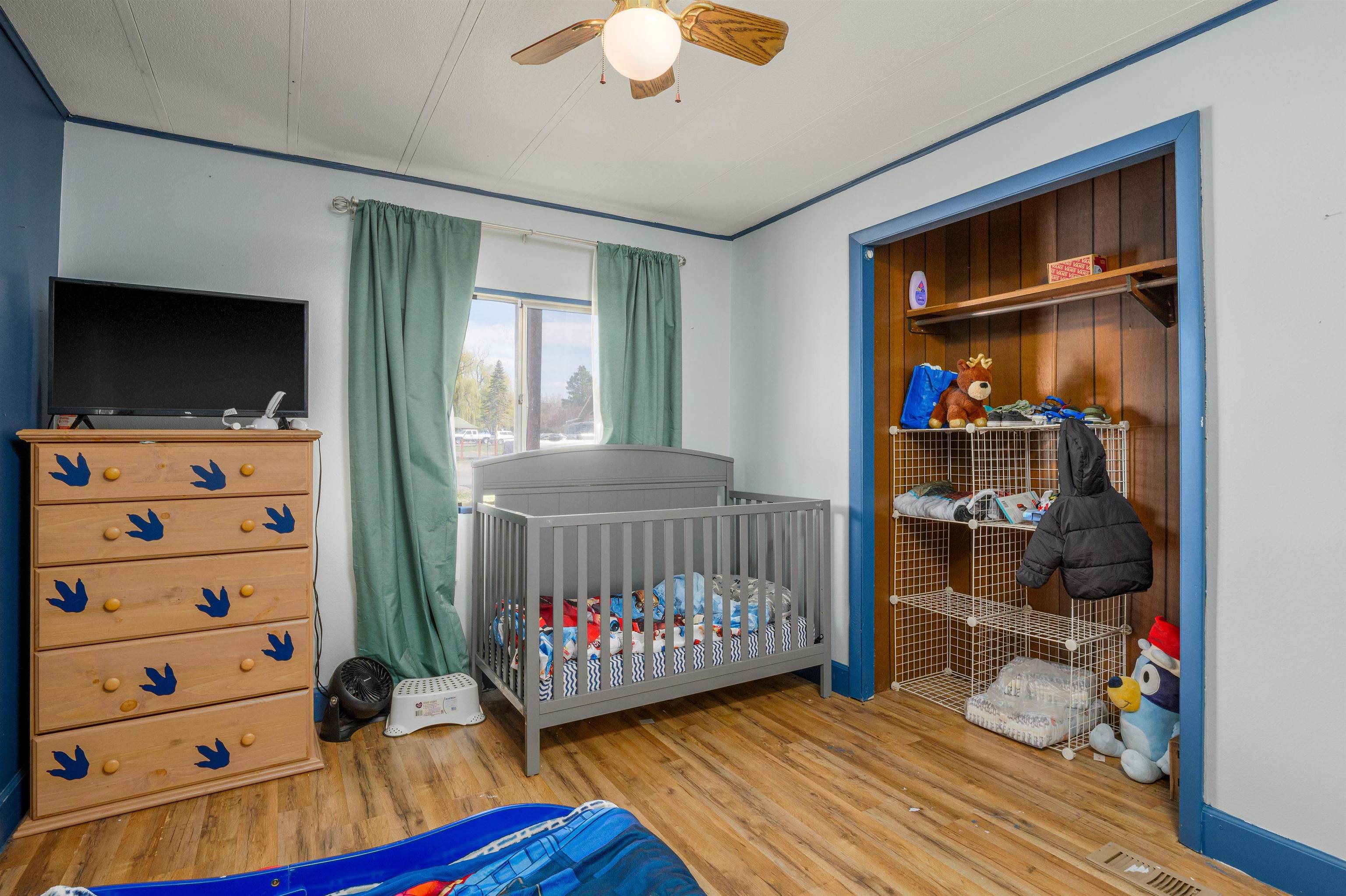 265 Southwest 11th Avenue Cedaredge, CO 81413 - Photo 17 of 39 a bedroom with furniture and a flat tv screen