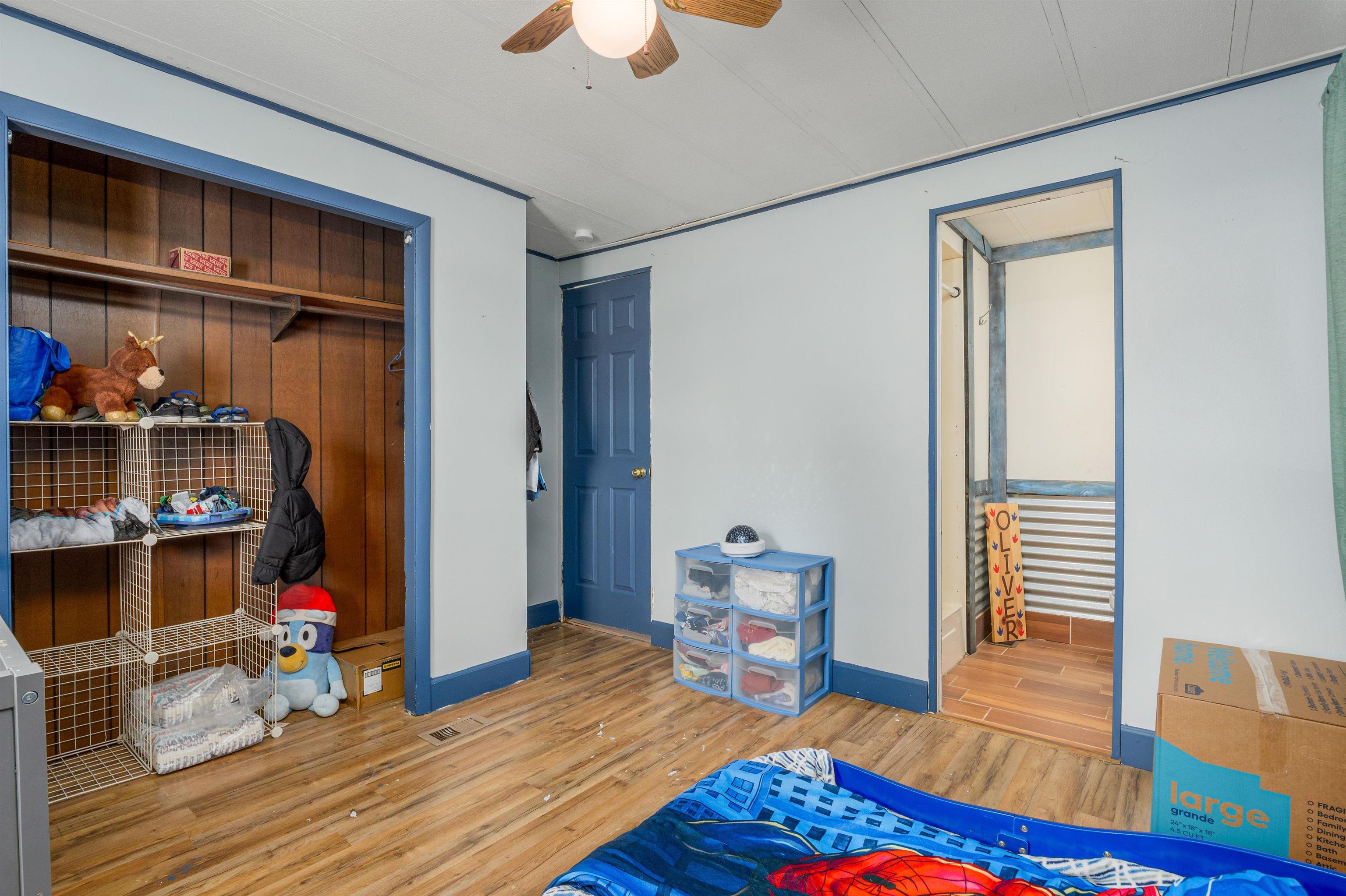 265 Southwest 11th Avenue Cedaredge, CO 81413 - Photo 18 of 39 a view of room with wooden floor and furniture