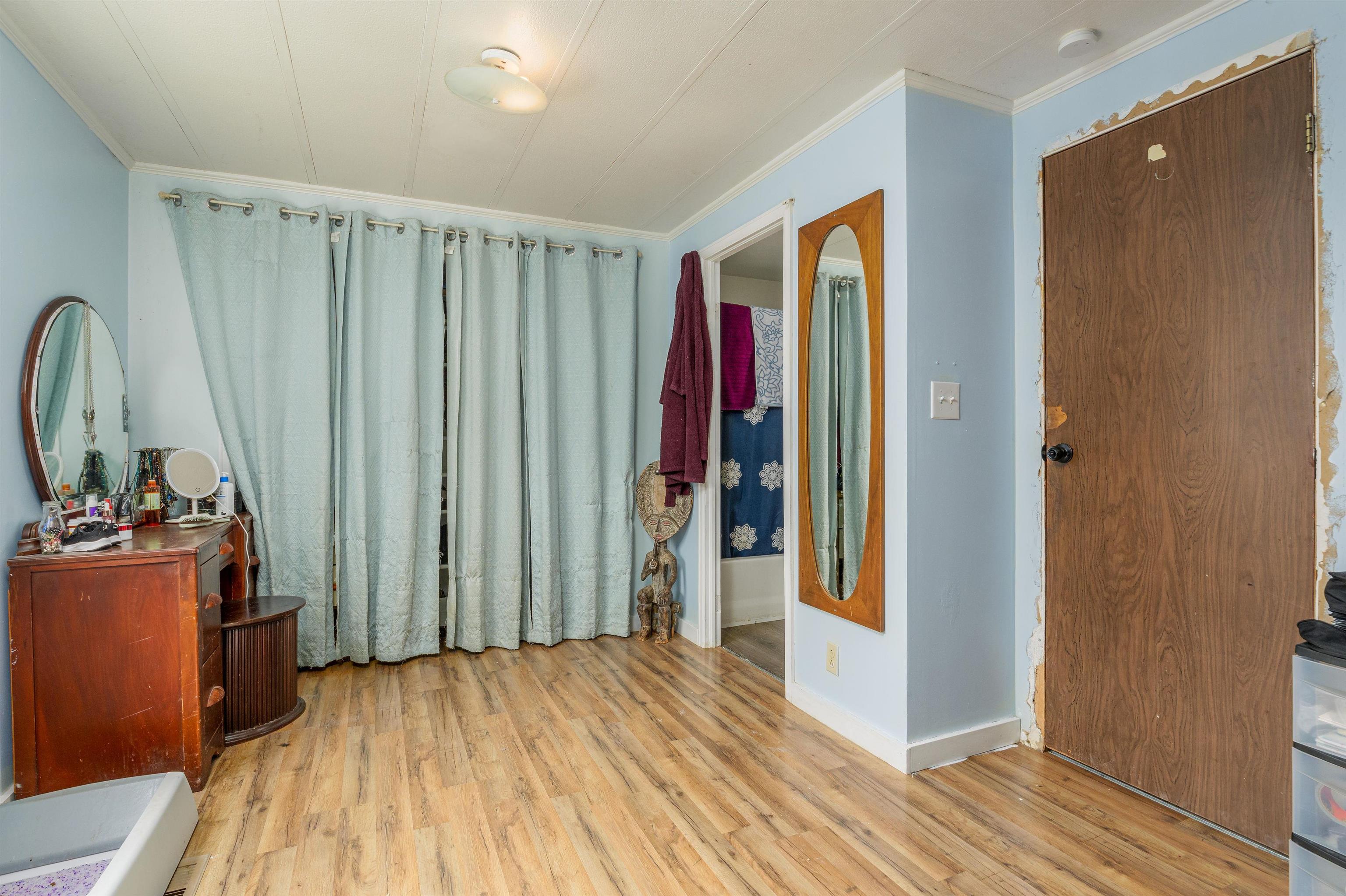 265 Southwest 11th Avenue Cedaredge, CO 81413 - Photo 23 of 39 a view of a hallway with closet and utility room
