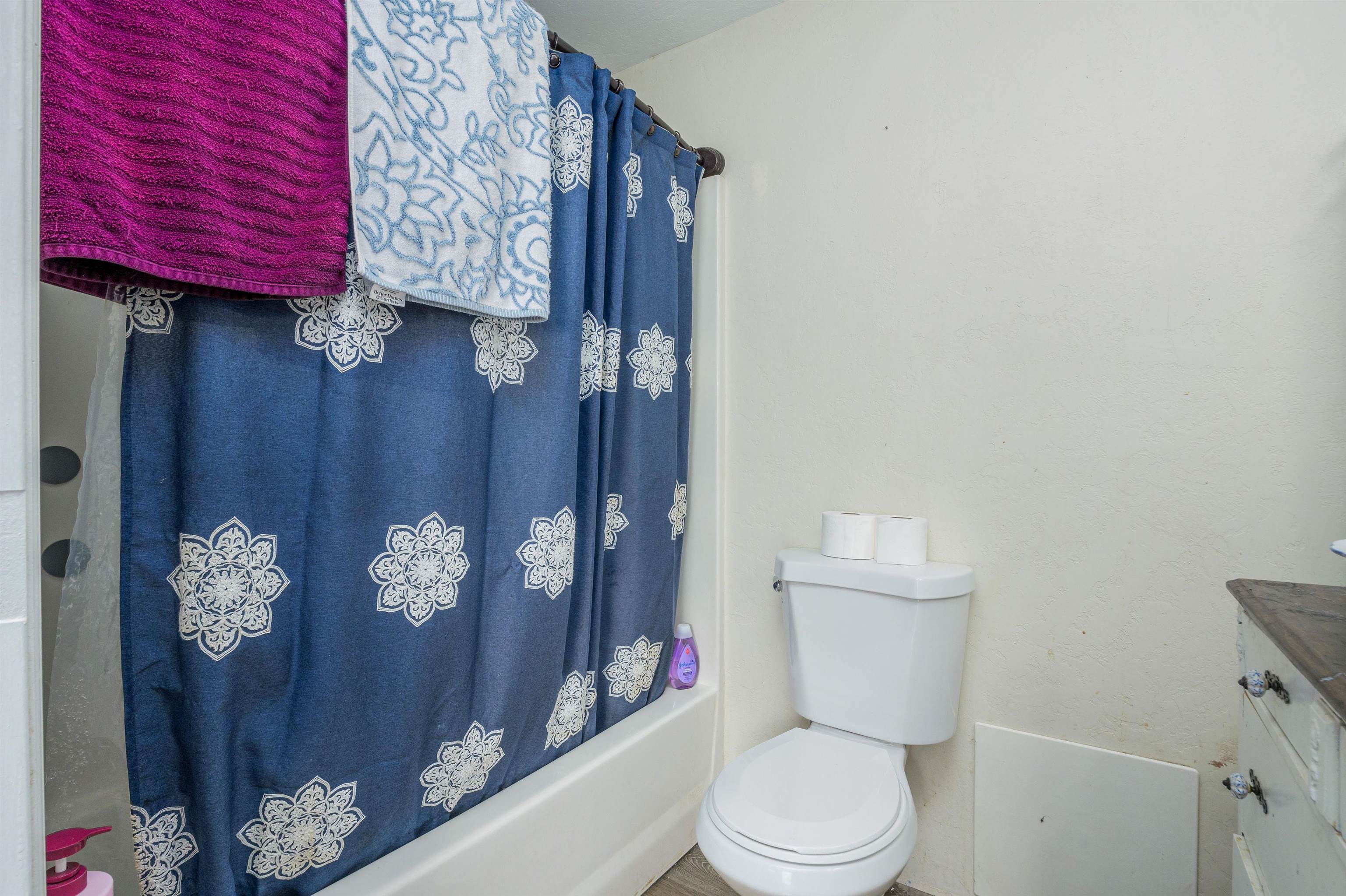 265 Southwest 11th Avenue Cedaredge, CO 81413 - Photo 27 of 39 a white toilet sitting next to a bathroom sink