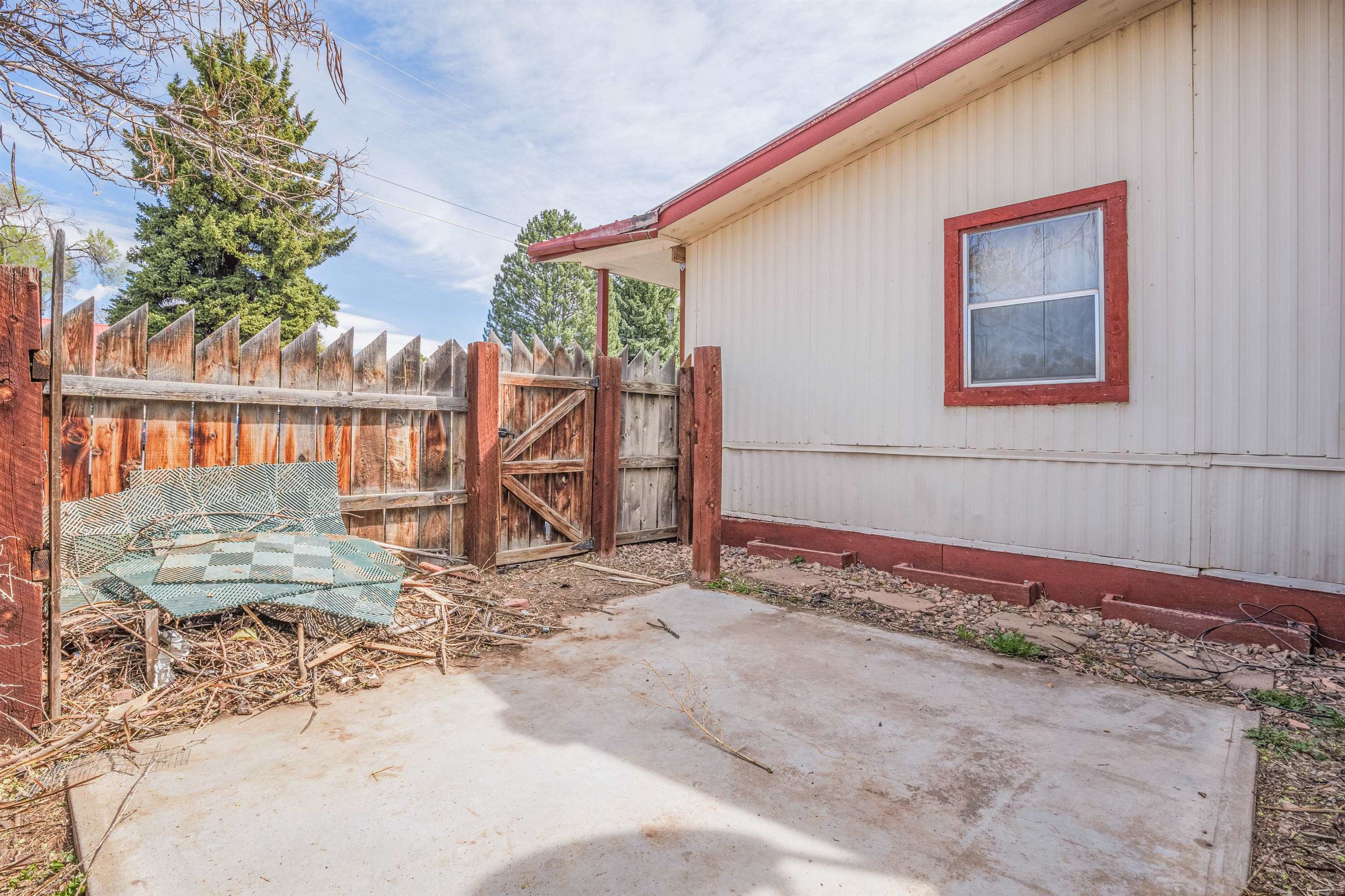 265 Southwest 11th Avenue Cedaredge, CO 81413 - Photo 29 of 39 a view of a house with backyard and sitting area