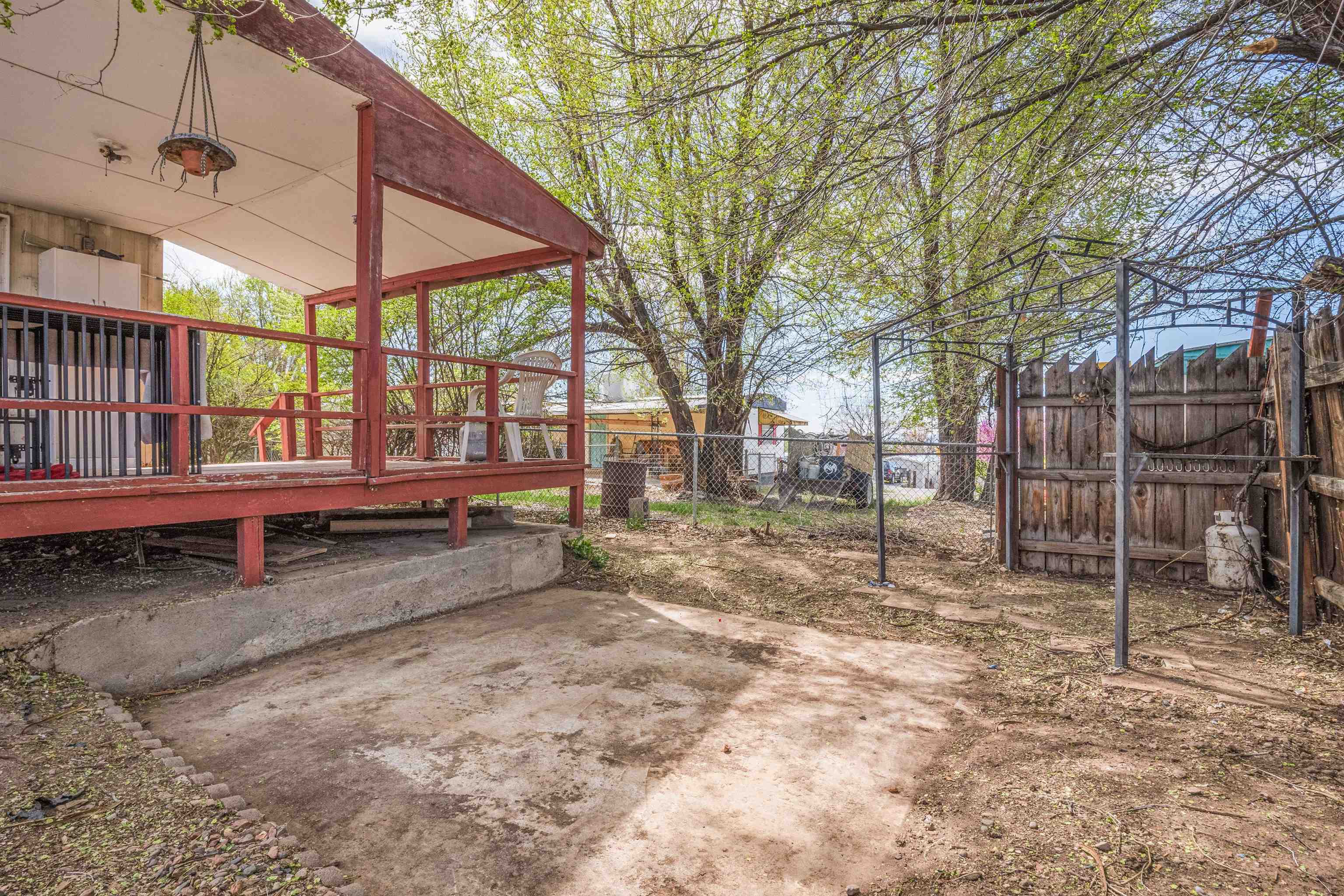 265 Southwest 11th Avenue Cedaredge, CO 81413 - Photo 30 of 39 a view of a backyard with wooden fence
