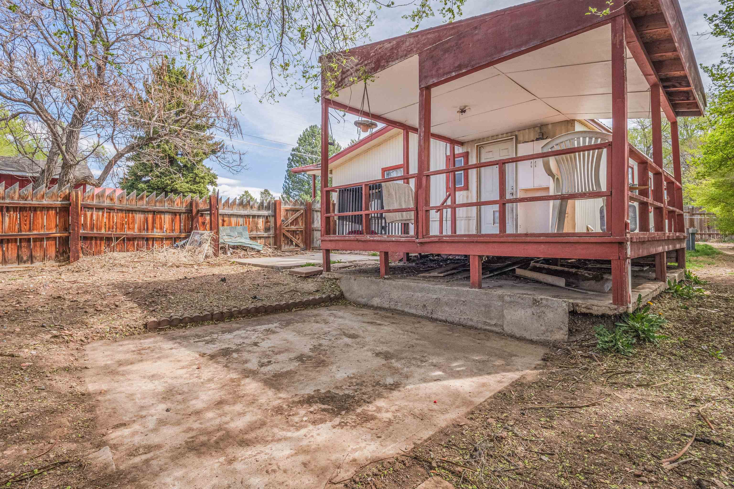 265 Southwest 11th Avenue Cedaredge, CO 81413 - Photo 31 of 39 a view of a house with a yard