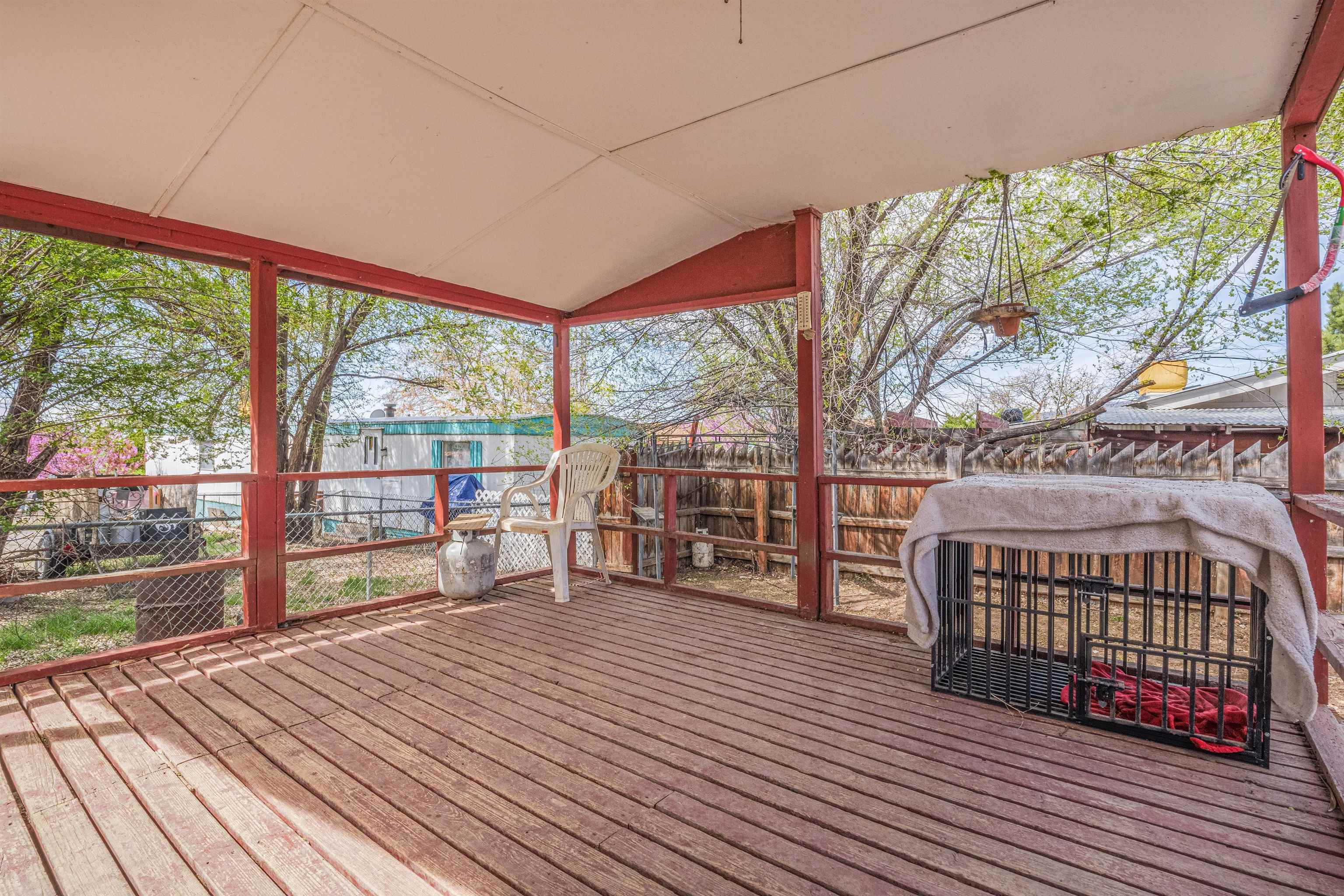 265 Southwest 11th Avenue Cedaredge, CO 81413 - Photo 32 of 39 a bedroom with furniture and large windows
