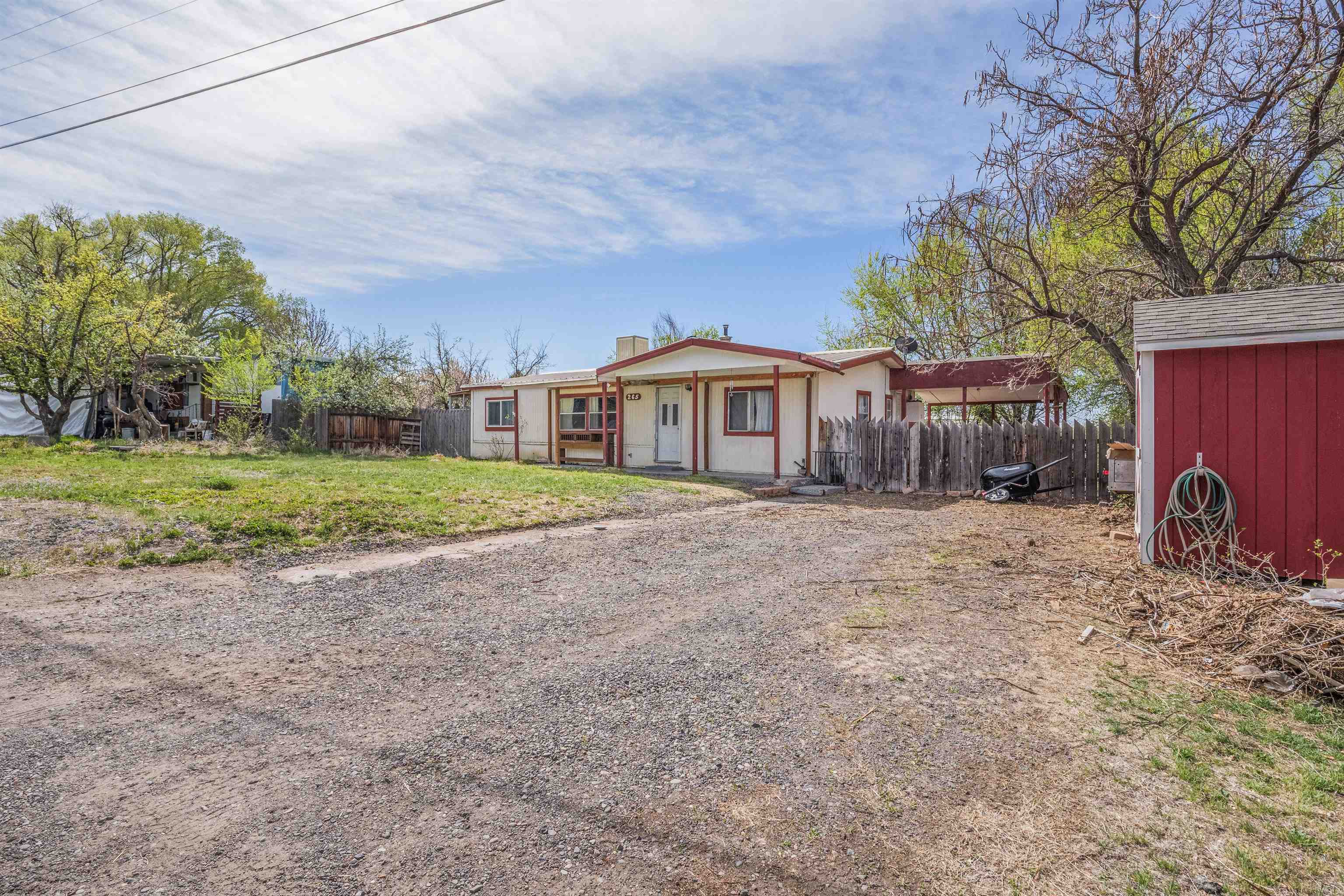 265 Southwest 11th Avenue Cedaredge, CO 81413 - Photo 39 of 39 a view of a house with a yard and tree s