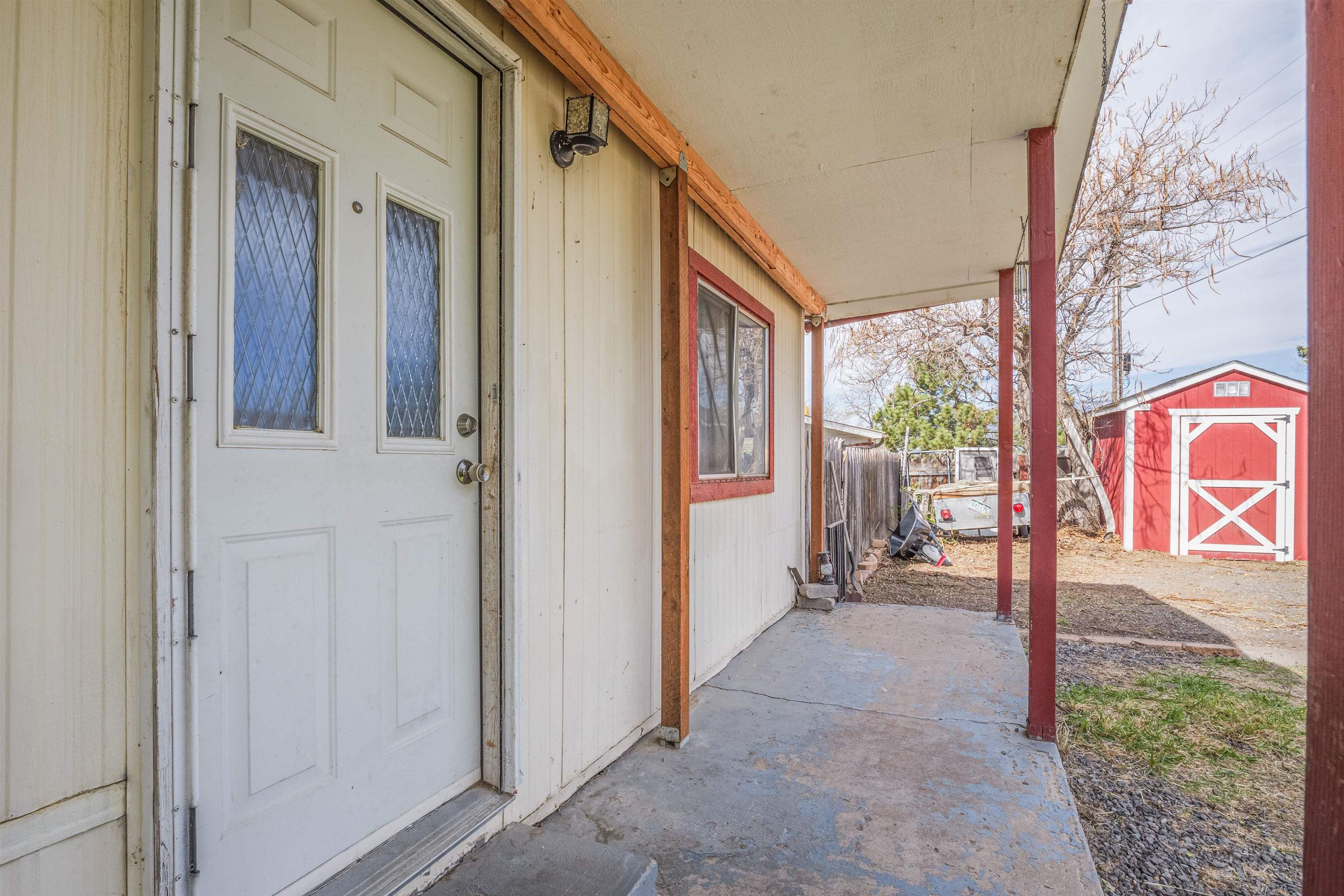 265 Southwest 11th Avenue Cedaredge, CO 81413 - Photo 4 of 39 a view of a porch with a door