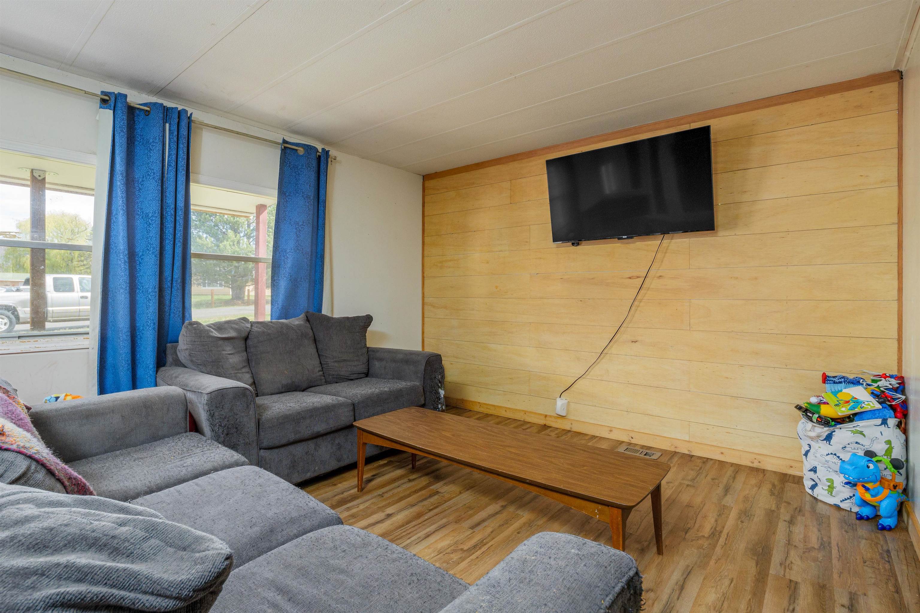 265 Southwest 11th Avenue Cedaredge, CO 81413 - Photo 7 of 39 a living room with furniture and a flat screen tv