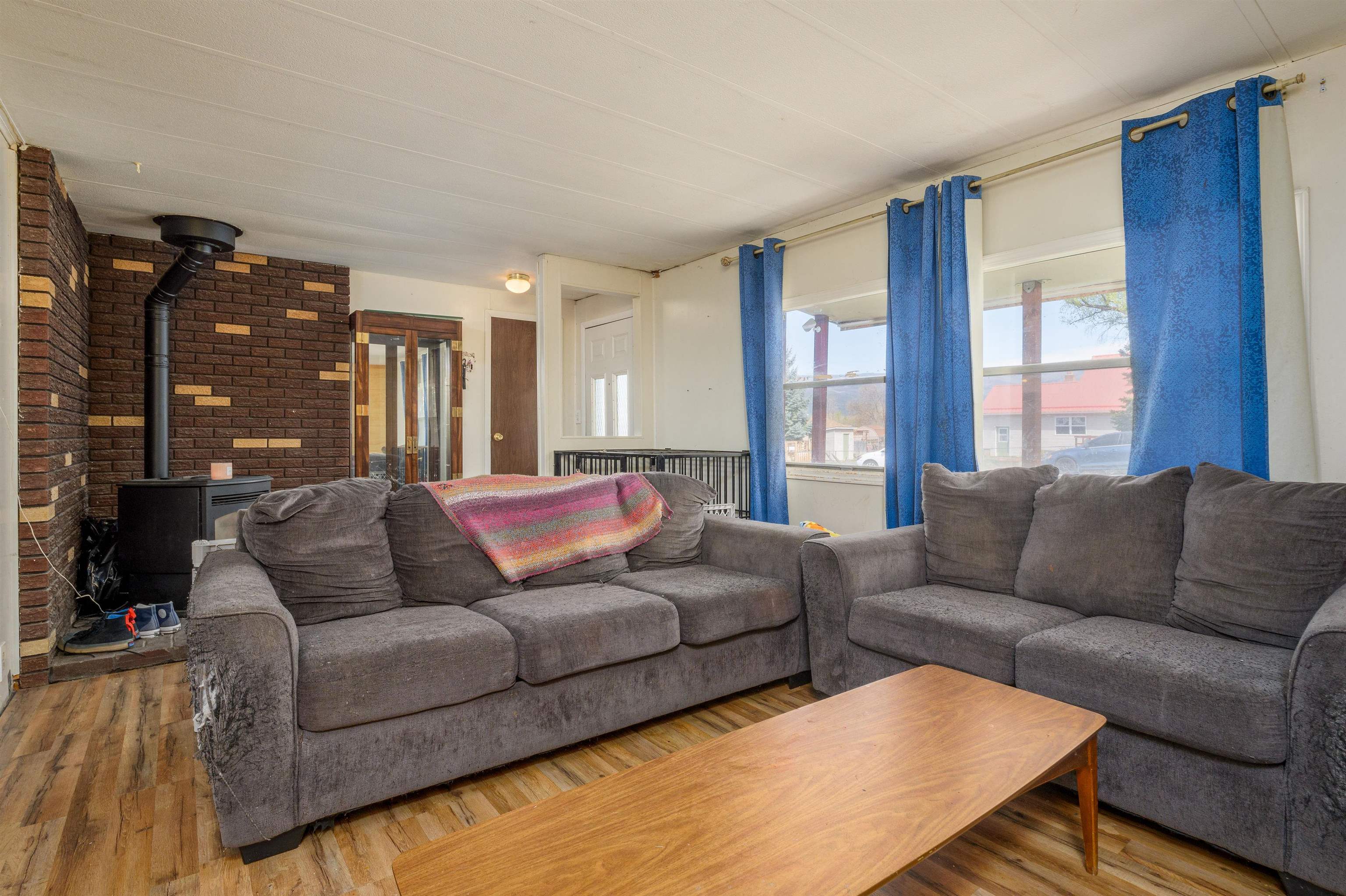 265 Southwest 11th Avenue Cedaredge, CO 81413 - Photo 8 of 39 a living room with furniture and large windows