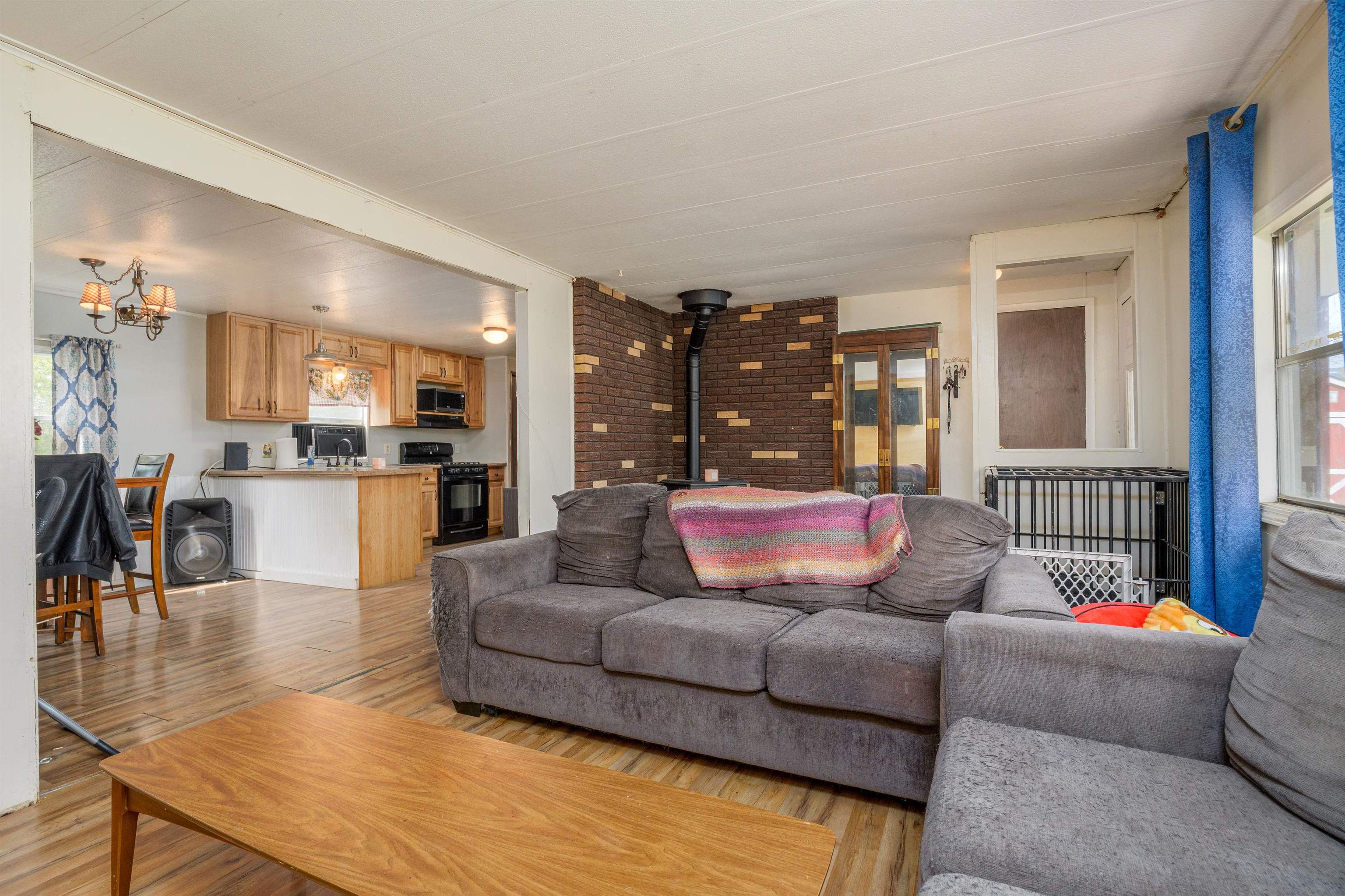 265 Southwest 11th Avenue Cedaredge, CO 81413 - Photo 9 of 39 a living room with furniture and a view of kitchen