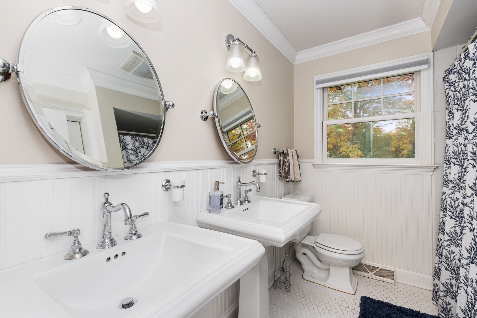 649 Forest Hill Road Lake Forest, IL 60045 - Photo 20 of 23 a bathroom with a sink and a mirror