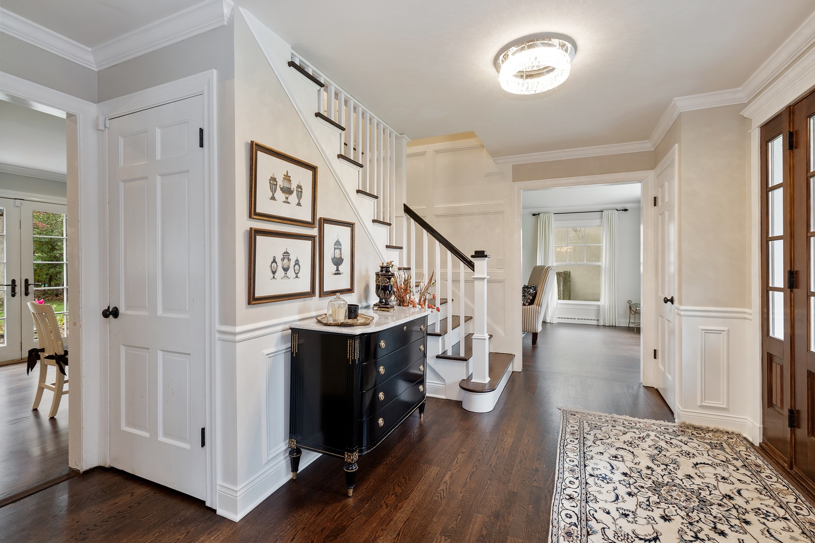 649 Forest Hill Road Lake Forest, IL 60045 - Photo 4 of 23 a view of a hallway with wooden floor and staircase