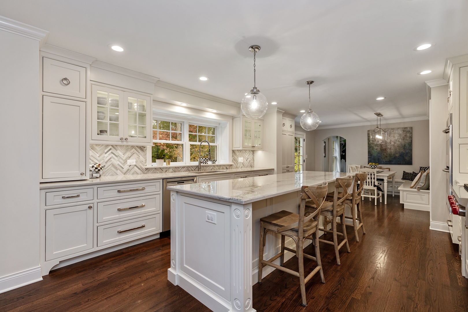 649 Forest Hill Road Lake Forest, IL 60045 - Photo 6 of 23 a large kitchen with lots of counter space a sink dining table and chairs