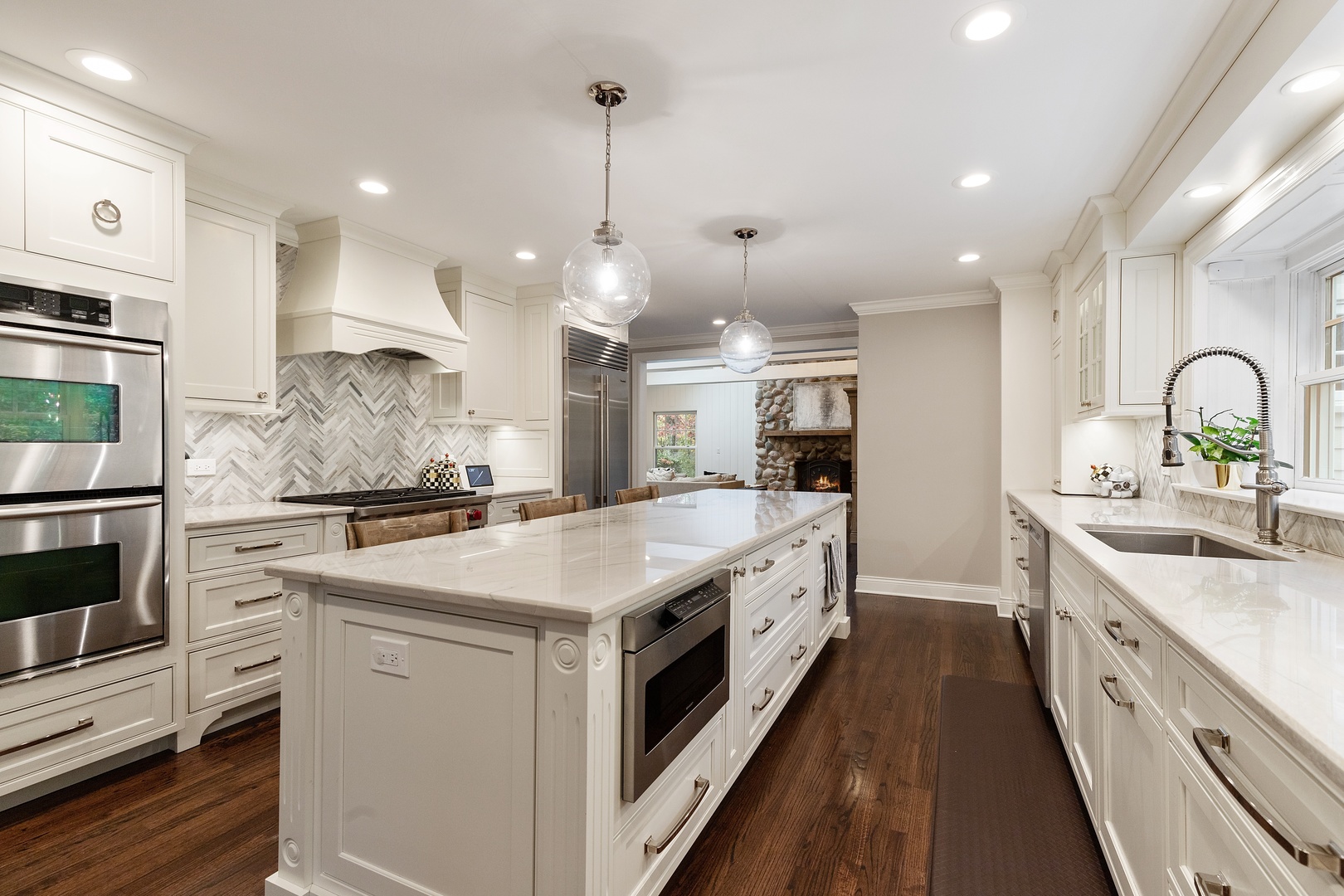 649 Forest Hill Road Lake Forest, IL 60045 - Photo 7 of 23 a large kitchen with stainless steel appliances kitchen island a large counter tops a stove a sink and a refrigerator