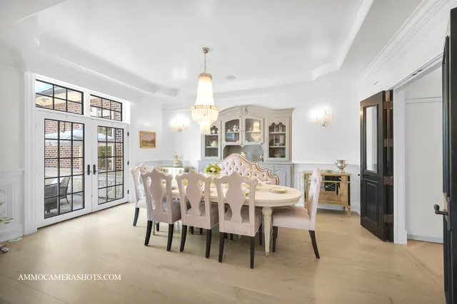 a large kitchen with kitchen island a stove a refrigerator a sink and a counter top space