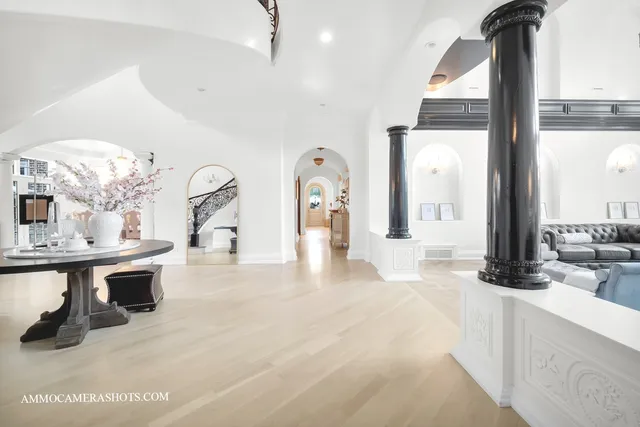 a kitchen with white cabinets and appliances