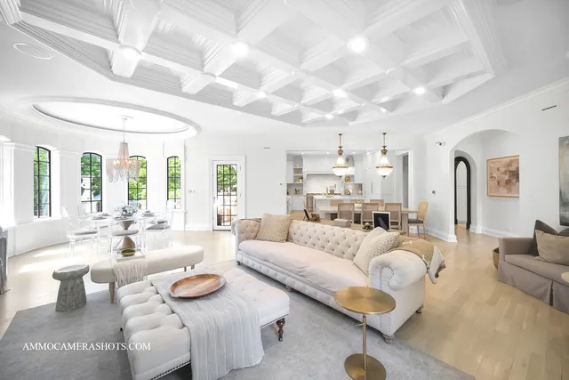 a living room with furniture a table and chairs