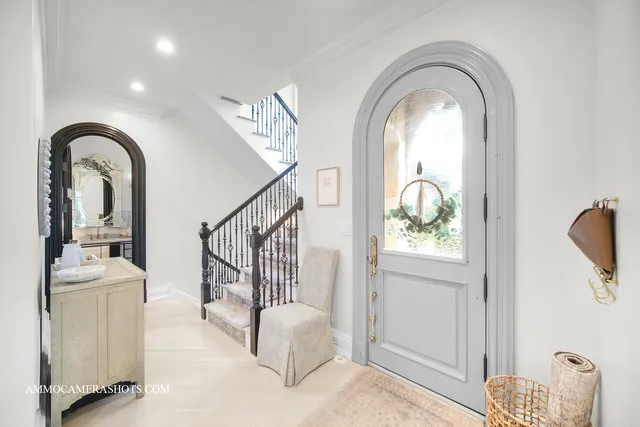 a bathroom with a sink a toilet a mirror and shower