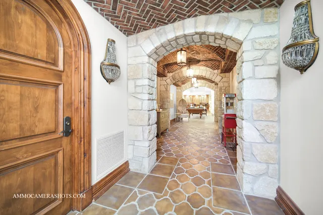 a view of a patio with table and chairs and potted plants