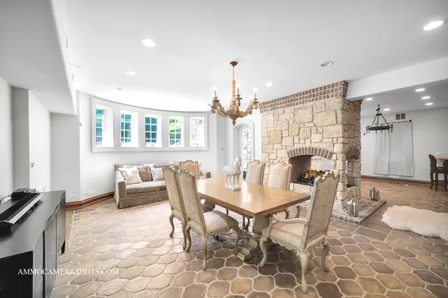 an aerial view of residential houses with outdoor space and trees