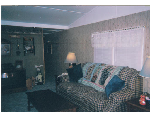557-39 Southwest Cutoff Worcester, MA 01607 - Photo 3 of 8 a bedroom with a bed and a lamp with window