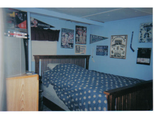 557-39 Southwest Cutoff Worcester, MA 01607 - Photo 4 of 8 a bedroom with a bed and wall painting