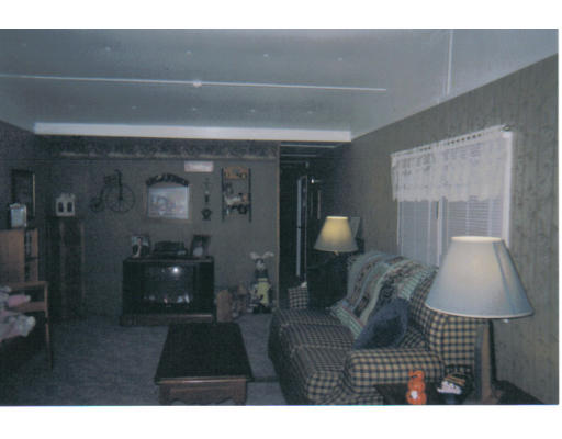 557-39 Southwest Cutoff Worcester, MA 01607 - Photo 8 of 8 a bedroom with a bed and a lamp