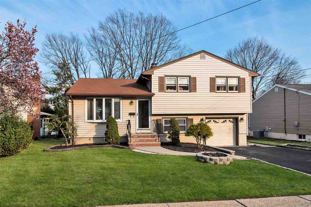 373 Foxwood Road Union, NJ 07083 - Photo 1 of 1 a front view of a house with a yard